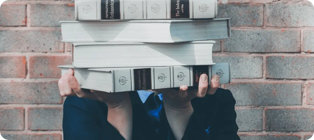 student holding books 1