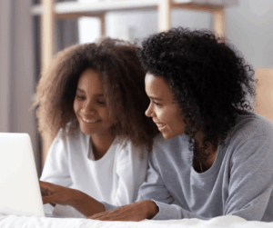 Parent and high school junior discussing college budget planning together