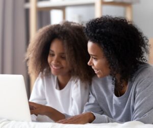 parent and student reviewing FAFSA on laptop